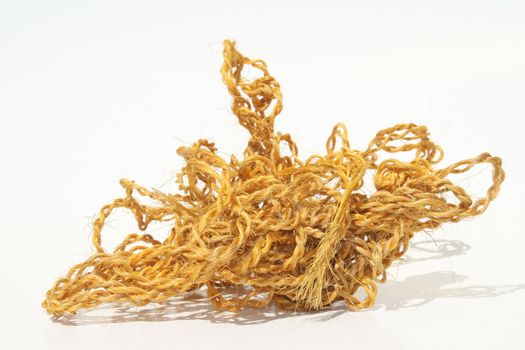 A tangled ball of twine on white background