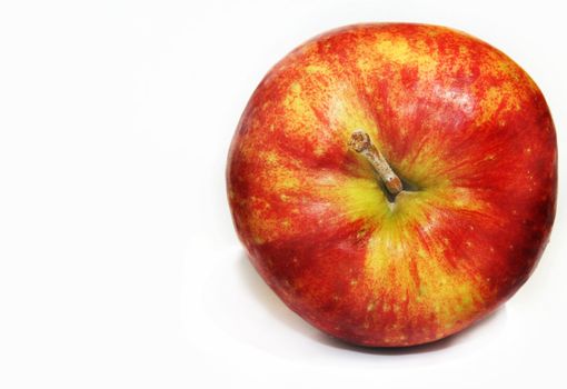 Single red apple against white background