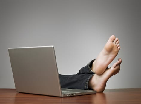 Lazy man with computer at the office