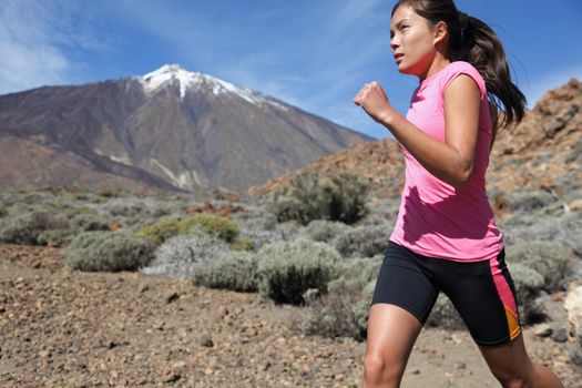 Runner. Woman running outside in beautiful nature.