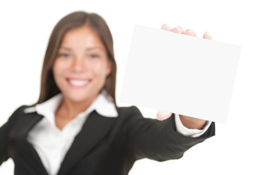 Business sign. Beautiful smiling woman holding big business card / blank empty sign. Isolated on white background, focus on hand and card.