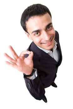 smiling businessman with O.K. on a white background