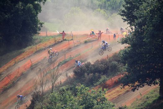 Motocross competitors in the dust