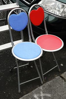 couple of chairs with heart shaped back