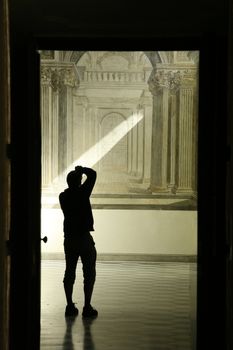 illuminated man making a photo inside saint martino carthusian monastery
