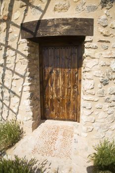 wood brown door of a mill at belmonte village spain