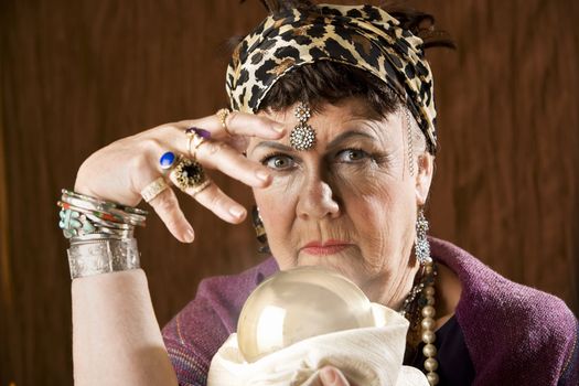 Female gypsy fortune teller with a crystal ball