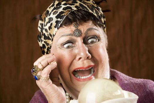 Female gypsy fortune teller with a crystal ball