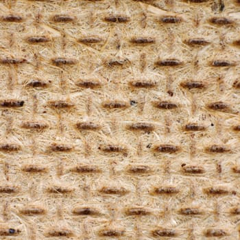 The rough surface of the brown panel