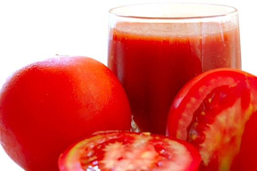 Fresh tomato juice and tomatoes on isolated background.