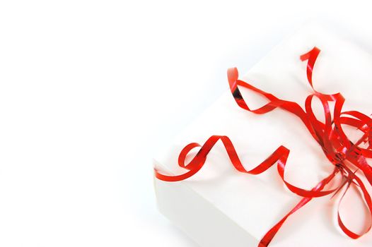 Gift box with red ribbon isolated on white background