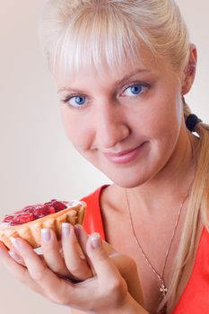 Woman in red posing with cherry cheese-cake. #1