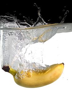 banana thrown in water with black and white background