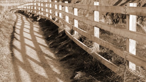 frosty winters view at ballybunion cliffside walk with atlantic view and fence shadows