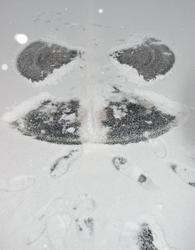 a snow angel on the road surface
