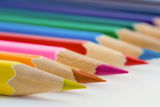 Closeup of colored crayons on white background