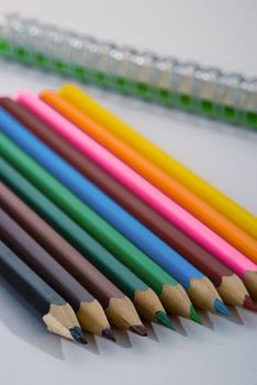 Closeup of colored crayons on white background