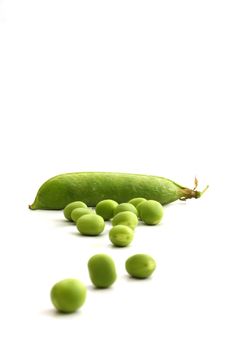 Fresh green peas on white background