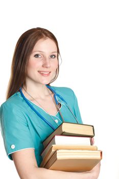 The portrait of kind female doctor in the green uniform with books