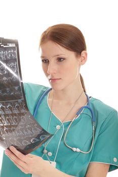 Young female doctor looking at the xray picture