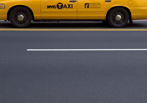 A New York yellow cab waiting on the street.