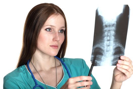 Young female doctor looking at the xray picture