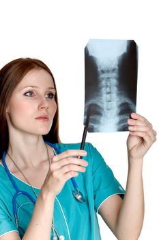 Young female doctor looking at the xray picture