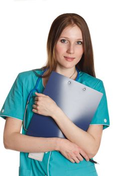 The portrait of kind female doctor in the green uniform
