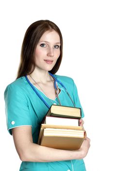 Portrait of female doctor in the green uniform with books
