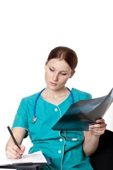 Young female doctor writing a diagnosis