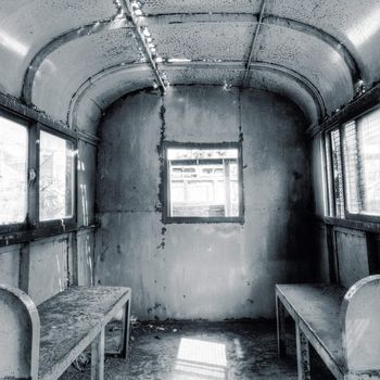 Interior of old deserted railway carriage with nobody.