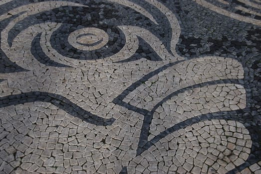 mosaic of a fish on the Praca do Comercio, Lisbon, Portugal