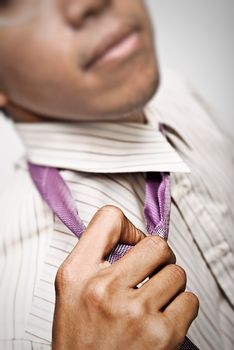 Businessman untie the tie for rest,closeup and focus on tie.