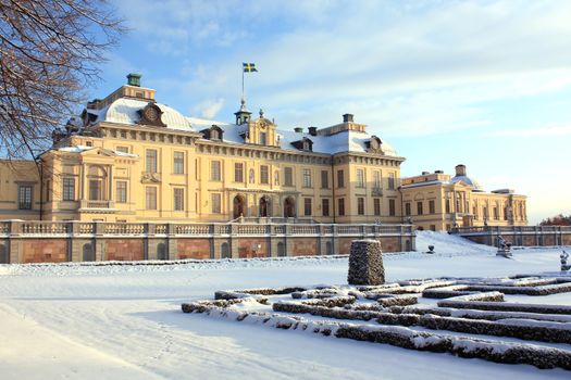 Winter view on Drottningholm palace, Sweden. The flag means that king is inside.