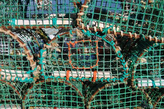 closeup of fishing nets lying in a harbor