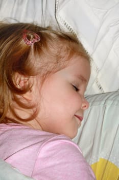 Small girl sweet sleeping on the pillow