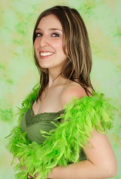 portrait of a young woman with green feather boa