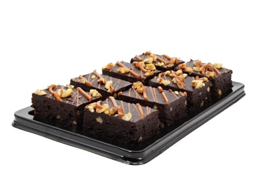 brownies on plastic tray, isolated on white