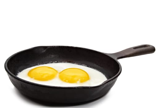 sunny side-up egg on a black cast iron pan