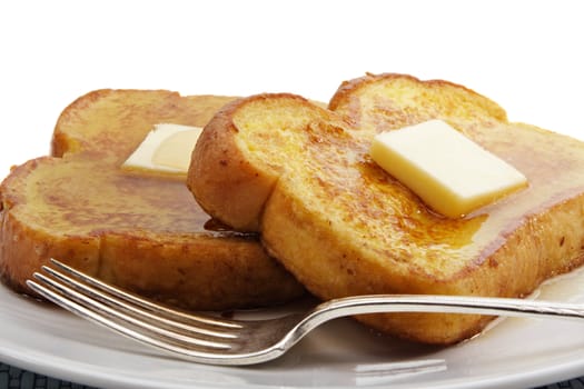 french toast with piece of butter, isolated on white