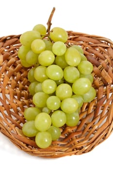 fresh green grape in wicker basket