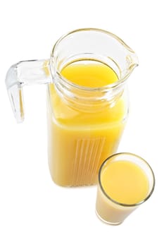jug and glass filled with fresh orange juice