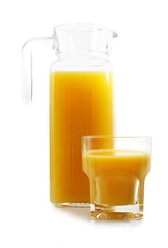 jug and glass filled with fresh orange juice