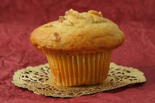 muffin on white paper, red background