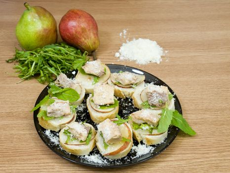 quick and delicious appetizers, with prepared salmon, rucola and pear