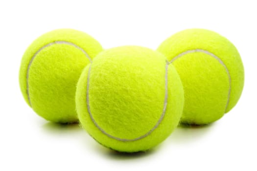 three yellow tennis ball