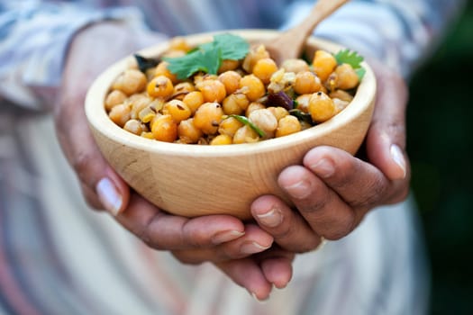 Female hands holding a bowl of chickpeas