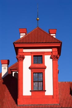 Photo of an one of turrets of Troja Chateau in bright solar morning