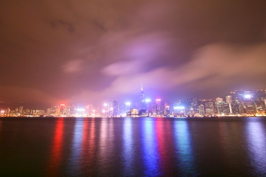 Hong Kong City Lights By Night Reflecting On Water