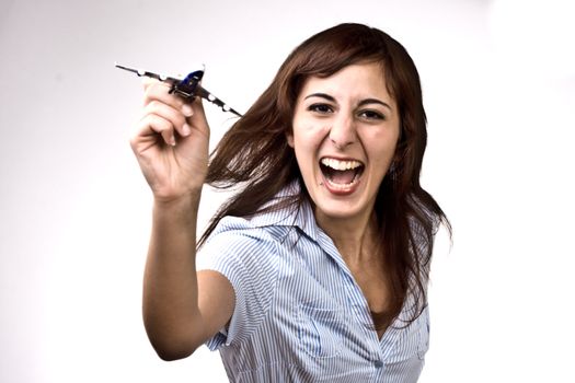Photo Of A Cheerful Woman Launching A Miniature Plane Model